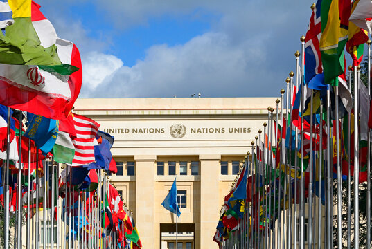 Geneva, Switzerland, Europe : Palace of Nations, national flags of the member states  in foreground, European Headquarters of United Nations, United Nations Office at Geneva (UNOG), Place des Nations