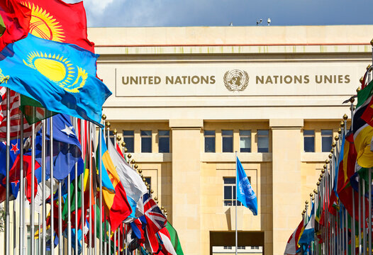 Geneva, Switzerland, Europe : Palace of Nations, national flags of the member states  in foreground, European Headquarters of United Nations, United Nations Office at Geneva (UNOG), Place des Nations