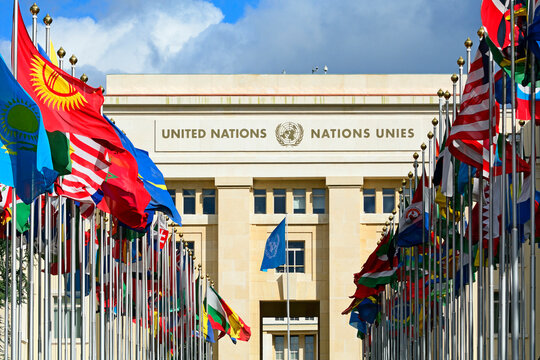 Geneva, Switzerland, Europe : Palace of Nations, national flags of the member states  in foreground, European Headquarters of United Nations, United Nations Office at Geneva (UNOG), Place des Nations