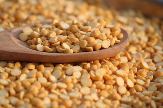 Toor dal is known as tur daal, yellow lentils split peas, indian split pigeon peas, arhar dal, tuvar dal, split peas, Yellow lentils, arahar daal, indian pulses. Concept of vegetarian protein food