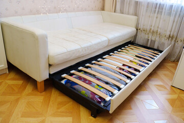 Sofa with storage underneath in a living room during daytime hours