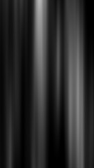 Fototapeta premium Minimal abstract background with vertical black and white light streaks, creating a modern motion blur and dramatic contrast effect