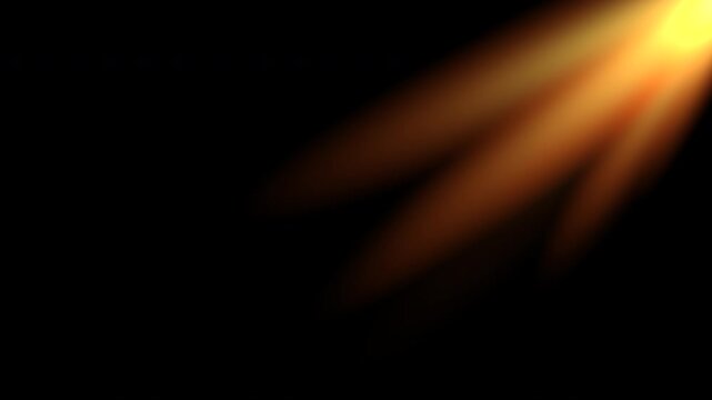 Cinematic golden sunlight beams on black background
