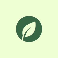 Minimalist Green Leaf Icon in Circle on Light Green Background, Nature and Ecology Symbol