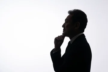 Fotobehang Ridders 悩む男性　シルエット  © naka