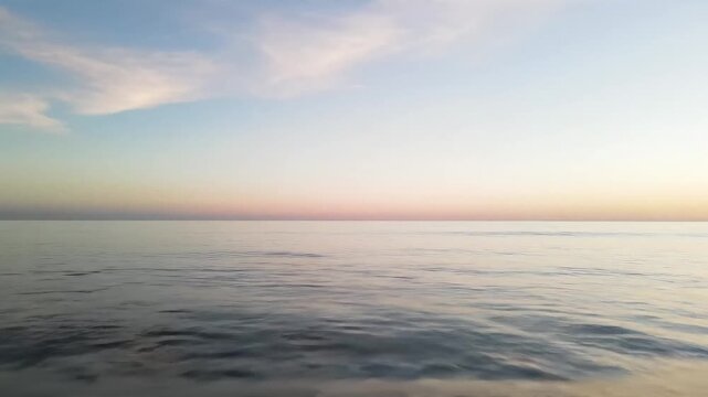 Minimal composition with thin ocean horizon line dividing water and sky