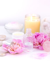 Pink flowers on white background spa facial. Selective focus.