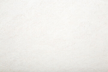 New light beige ceramic tile pattern background. Closeup. Top down view.