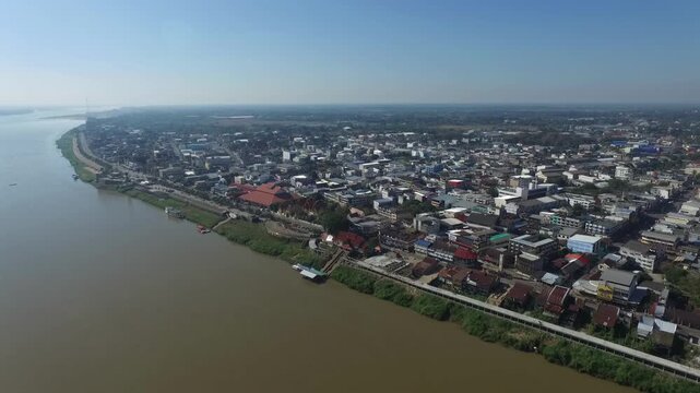 Aerial view of Nakhon Phanom city skyline along the Mekong River, Thailand.