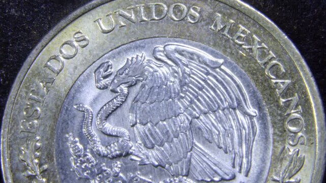 Mexican peso coin with eagle and snake, symbolizing strength and unity