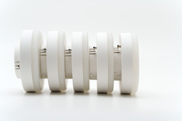 Dimmable led lamp model 53 gx stacked on a plain white surface