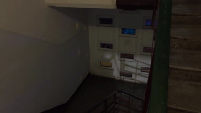 Moody urban environment with illuminated windows and geometric shadows enhances film or architectural visuals