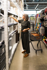Shopping for storage containers in a home goods store during a weekday afternoon