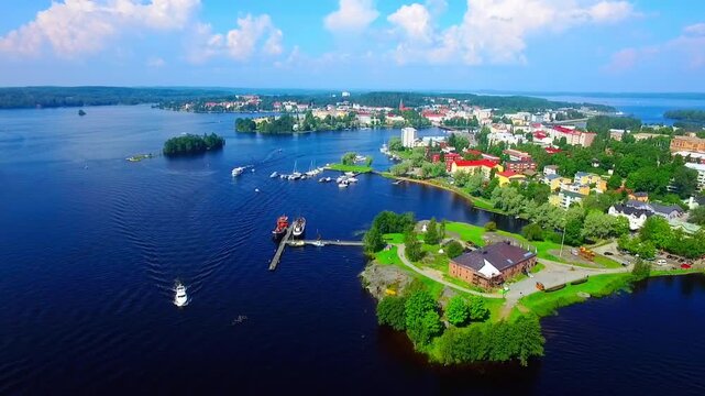 Aerial view of Olavinlinna Medieval Castle in Savonlinna, Finland. Beautiful summer landscape with blue lakes and clear sky