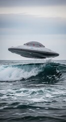 Futuristic metallic ufo hovering above ocean waves under cloudy sky during daytime exploration