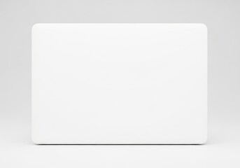 Naklejka premium Minimalist White Laptop Skin Mockup With Rounded Corners and Subtle Shadows on a Seamless White Background Isolated White Background