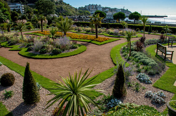 Obraz premium Italian gardens at Torre Abbey Park and meadows. Landmark tourist attraction Tropical palms, Mediterranean plants showcase the English Riviera. 