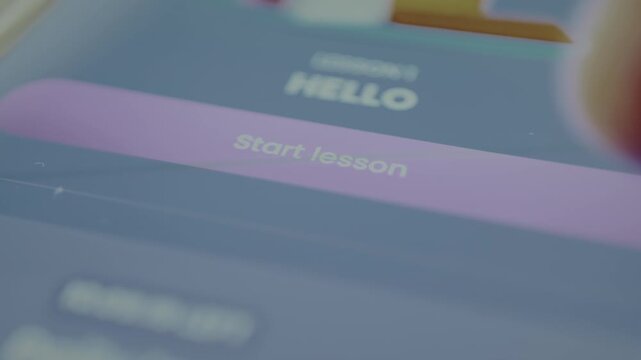 User taps the digital button labeled START LESSON within a mobile app interface