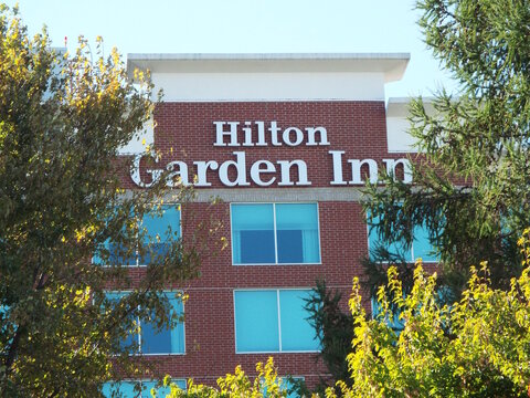 Ottawa, ON, Canada-July 12,2025: The brick exterior of a "Hilton Garden Inn" hotel at 2400 Alert Rd.