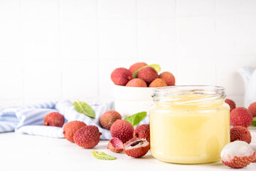 Homemade Lychee jam marmalade in jar, with fresh ripe lychees fruits © ricka_kinamoto