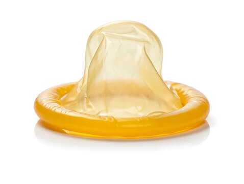 Yellow transparent female condom with flexible ring design shown clearly