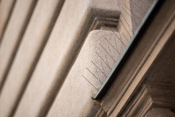 Bird deterrent spikes on stone building ledge © Mirko