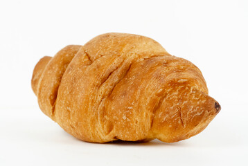 Fototapeta premium Freshly Baked Golden Brown Croissant with Crispy Flaky Layers Isolated on White Background