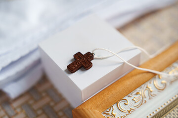 Cross on a small box with decorative frame in a simple setting