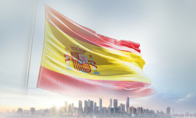 Spain flag waving with modern futuristic buildings. Spain national flag beautifully waving in the sky.