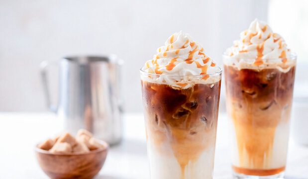 Iced caramel latte coffee in a tall glass with caramel syrup

