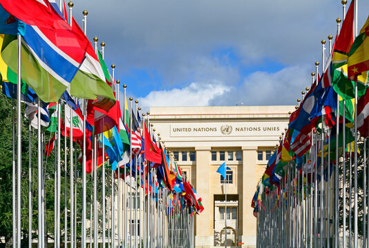 Geneva, Switzerland, Europe : Palace of Nations, national flags of the member states  in foreground, European Headquarters of United Nations, United Nations Office at Geneva (UNOG), Place des Nations