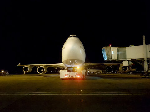 Tehran, Iran - January 15, 2017 - Front view of a large Boeing 747 Series 400 aircraft and its jetway alongside it on the ramp of Imam Khomeini Airport