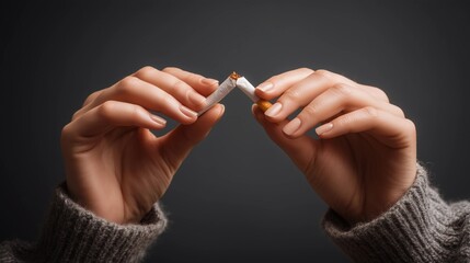 Hands holding a cigarette, concept of health and prevention,copy space,world no tobacco day.