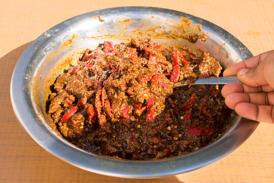Indian local dish red chilli pickle or lal mirch ka achar, loncha in a natural sun light.