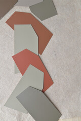 cut, layered brown and gray cards on textured paper