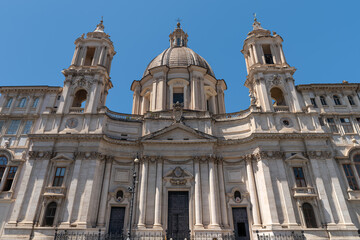 Fototapeta premium Italy - Rome - Sant Agnese in Agone - Elegant baroque church facade displays Borromini's architectural genius in marble