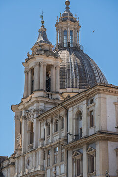 Italy - Rome - Piazza Navona - Sant Agnese in Agone magnificent dome and twin bell towers pierce azure Roman sky