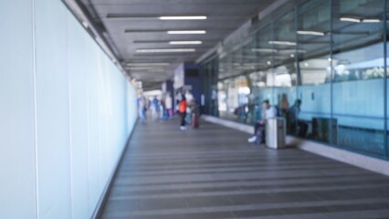 Airport terminal with soft bokeh blur and defocused architectural lines station; background backplate copyspace calm.