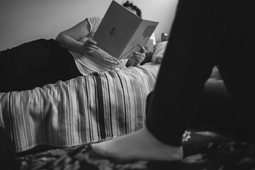 The mother helps the child to study