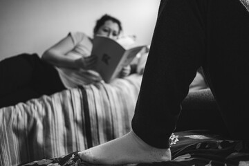 The mother helps the child to study