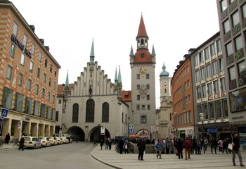 Obraz premium Historic Old Town Hall in Munich photographed in 2011, featuring its white facade, stepped gables and tower housing the famous Toy Museum, located at Marienplatz, DE, 17 Feb. 2011