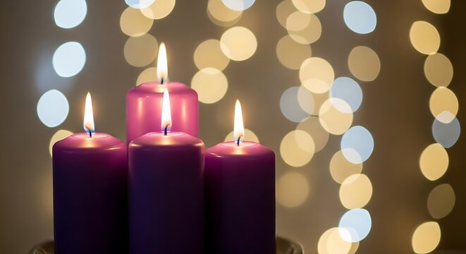 Four purple advent candles lit in a dimly lit room with a soft bokeh background of glowing lights
