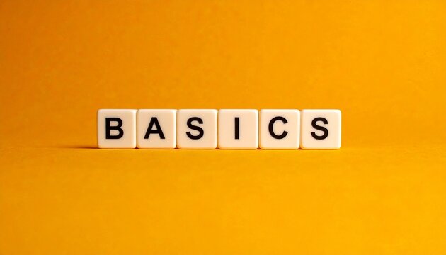 &ldquo;Basics&rdquo; Word on White Tiles with Orange Background Showcasing Simplicity, Foundational Concepts, and Educational Design