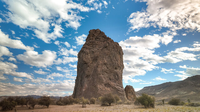 Wide angle shot Piedra Parada monolith under blue cloudy sky