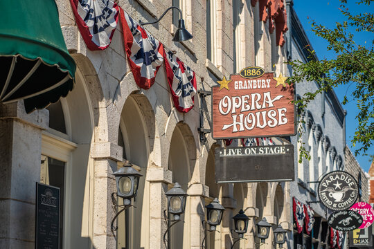 Granbury Opera House Live on Stage Sign and Red White and Blue Decor On Side of Theater Building on Downtown Town Square of Granbury, Texas