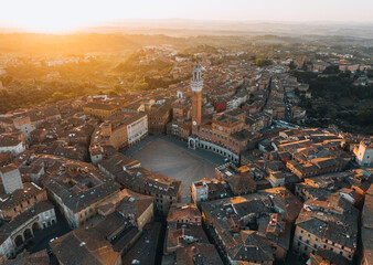 Naklejka premium Aerial View of Torre del Mangia and Piazza del Campo at Sunset, Siena, Tuscany, Italy