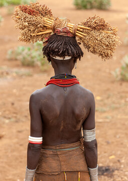 Dassanech woman with dried sorghum on her head, Omo valley, Omorate, Ethiopia