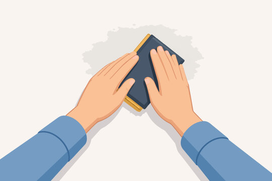 Hands sanding a surface with sandpaper block for renovation or diy project