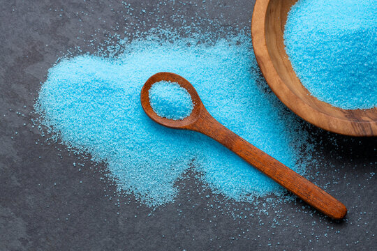 Fine blue salt crystals in a bowl and spoon - Potassium fluoride