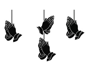 Obraz premium Three pairs of praying hands hanging from strings in a prayerful gesture